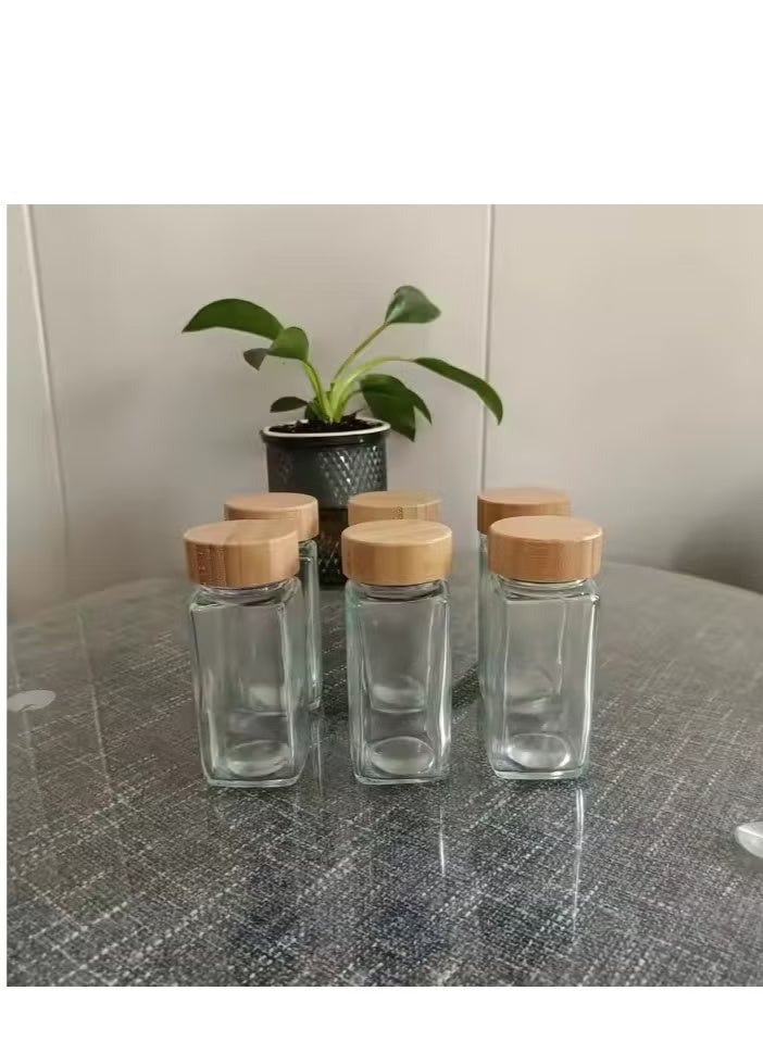 24 قطعة من برطمانات التوابل الزجاجية الفارغة توابل مربعة للاعشاب والتوابل لتخزين وتنظيم المطبخ بالأغطية وقمع للتعبئه وملصقات باللغه العربية والانجيليزية - Image 4